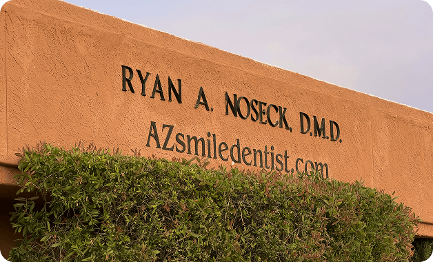 Exterior sign for Ryan A. Noseck, DMD and AZSmileDentist.com at the Tucson dental office